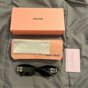 Black Miu Miu sunglasses